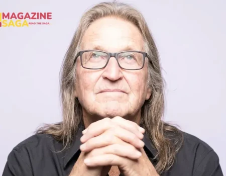 George Jung, known as Boston George, photographed in his later years wearing glasses and a black shirt