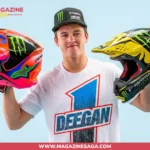 Haiden Deegan holding two Monster Energy motocross helmets, representing his net worth built through championship racing and sponsorships in 2026