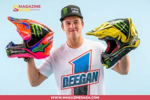 Haiden Deegan holding two Monster Energy motocross helmets, representing his net worth built through championship racing and sponsorships in 2026