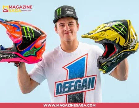 Haiden Deegan holding two Monster Energy motocross helmets, representing his net worth built through championship racing and sponsorships in 2026