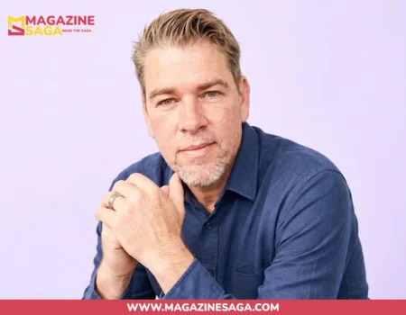 Portrait of a man in a blue button-down shirt, used for the Kevin Knasel biography article.