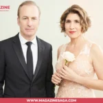 Naomi Yomtov and Bob Odenkirk posing together at a formal event, Naomi holding a white rose