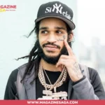 OT7 Quanny, North Philadelphia rapper, posing in a Sinclair NY cap and Cuban link chains