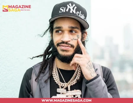 OT7 Quanny, North Philadelphia rapper, posing in a Sinclair NY cap and Cuban link chains