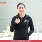 Gillis wearing a SpaceX uniform jacket, smiling ahead of the Polaris Dawn mission in 2024