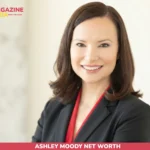 Ashley Moody net worth headshot, senator smiling in black blazer with red top