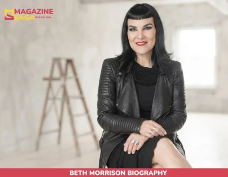 Beth Morrison biography portrait in black leather jacket, seated in a studio