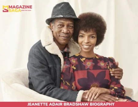 older man and young woman seated together, arms embraced, smiling at camera
