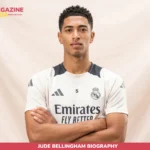 Jude Bellingham in Real Madrid home kit, arms crossed, studio portrait