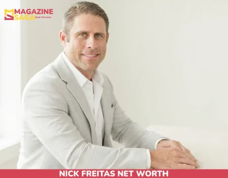 Nick Freitas net worth portrait, man in gray blazer seated at wood table