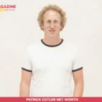 Patrick Cutler headshot, curly hair and glasses, white ringer tee, plain backdrop
