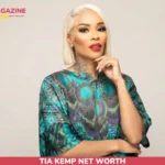 Tia Kemp Net Worth portrait, blonde bob, teal patterned kaftan, studio backdrop