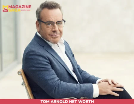 Tom Arnold seated in a blazer for the Tom Arnold net worth article
