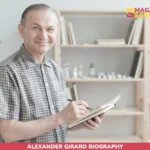 Alexander Girard smiling in checked shirt, sketching in notebook for net worth article