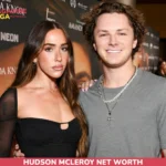 Hudson McLeroy net worth in grey t-shirt with layered necklaces, red carpet photo for article