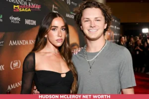 Hudson McLeroy net worth in grey t-shirt with layered necklaces, red carpet photo for article