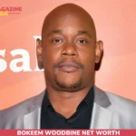 Bokeem Woodbine Net Worth article portrait in silver blazer at press backdrop