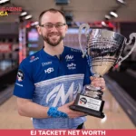 EJ Tackett holding a PBA trophy on the lanes for the EJ Tackett net worth article.