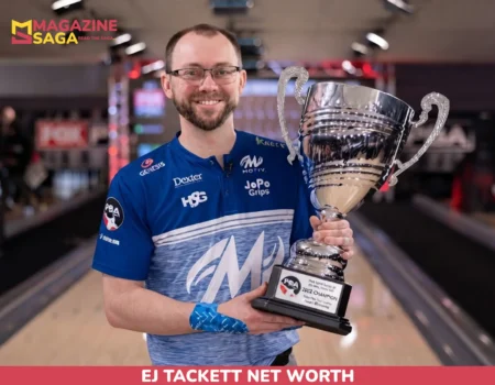 EJ Tackett holding a PBA trophy on the lanes for the EJ Tackett net worth article.