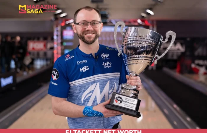 EJ Tackett holding a PBA trophy on the lanes for the EJ Tackett net worth article.