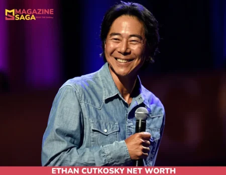 Henry Cho on-stage portrait with microphone for the net worth article