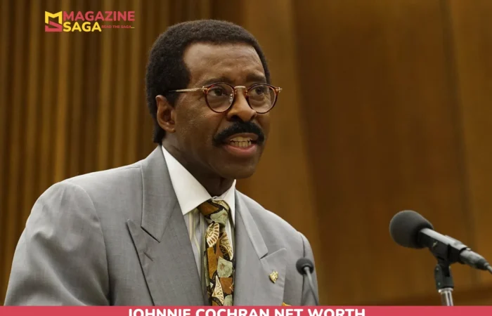 Johnnie Cochran Net Worth at Death – $8M Estimate (2005) Johnnie Cochran net worth article portrait: man in gray suit and round glasses speaking at a podium
