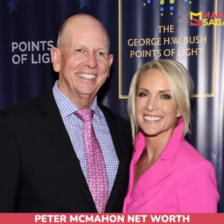 Peter McMahon net worth article photo: two people smiling in front of a navy event backdrop